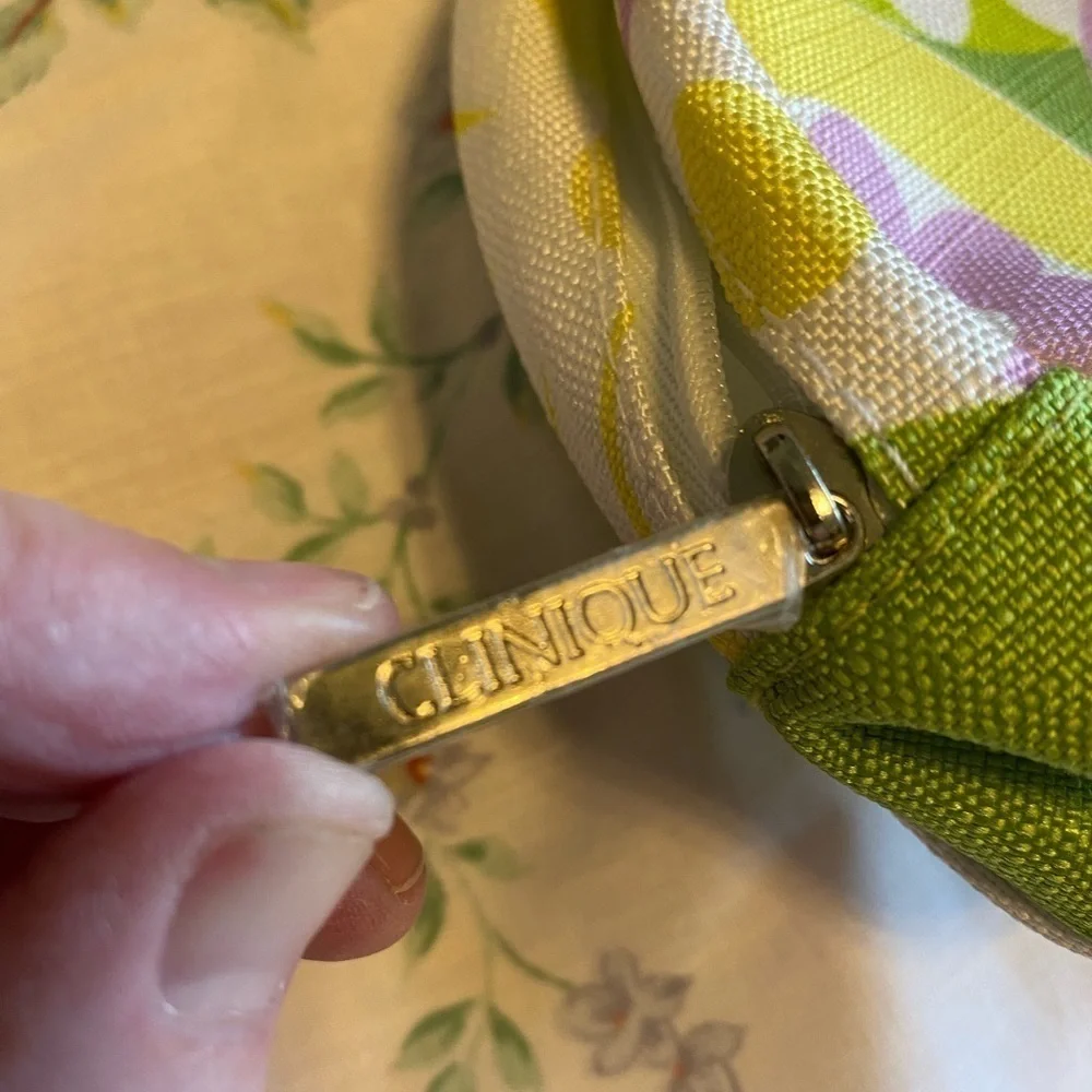 Clinique NWOT cosmetic bag. Green, yellow, purple and white. White inside